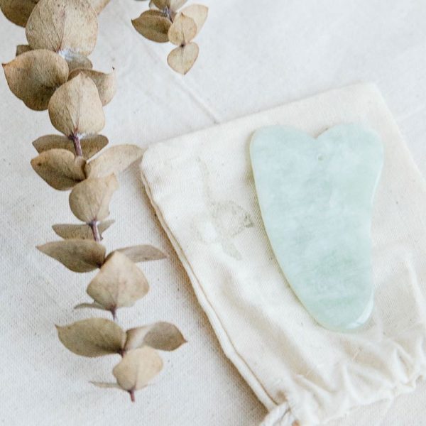 uniquely carved gua sha stone made from jade - buy online from our melbourne clinic
