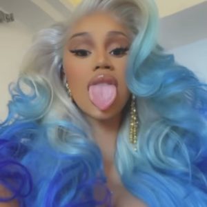 Tongue poked out of Cardi B with mermaid blue hair
